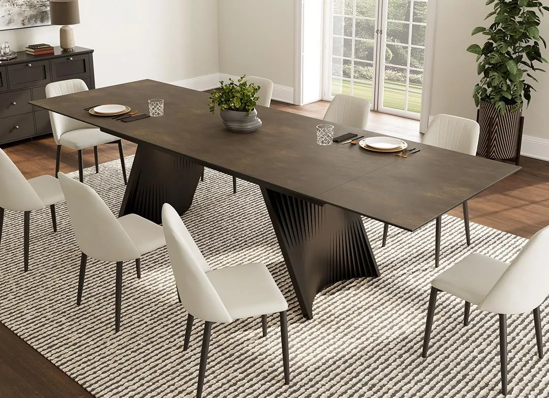 A round pedestal dining table showing open space for legroom beneath the top.