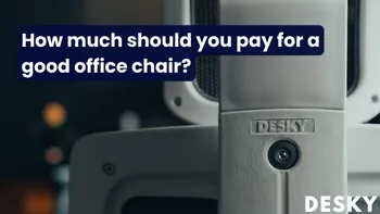 Sleek designer chair next to an adjustable ergonomic office chair in a showroom.