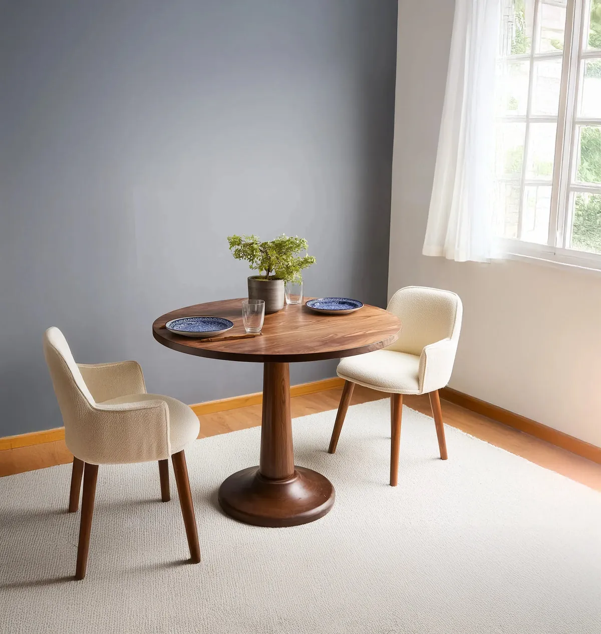 A small dining table creating a cramped walkway near a kitchen island.