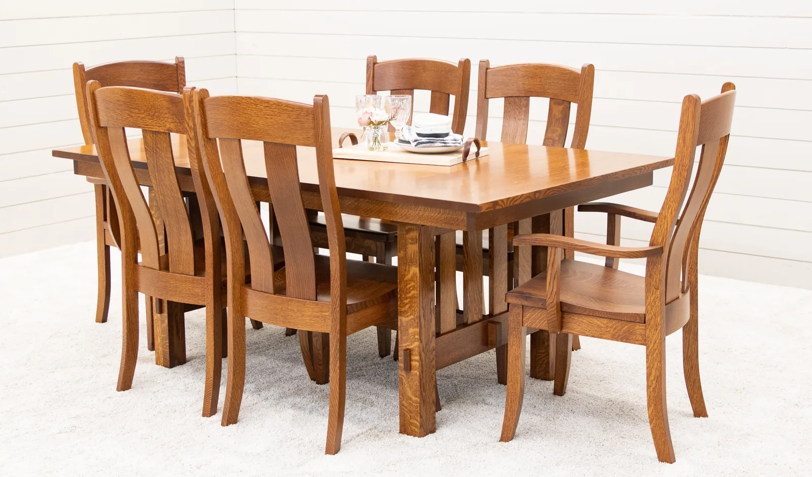 A square counter-height table with barstools in a modern kitchen.