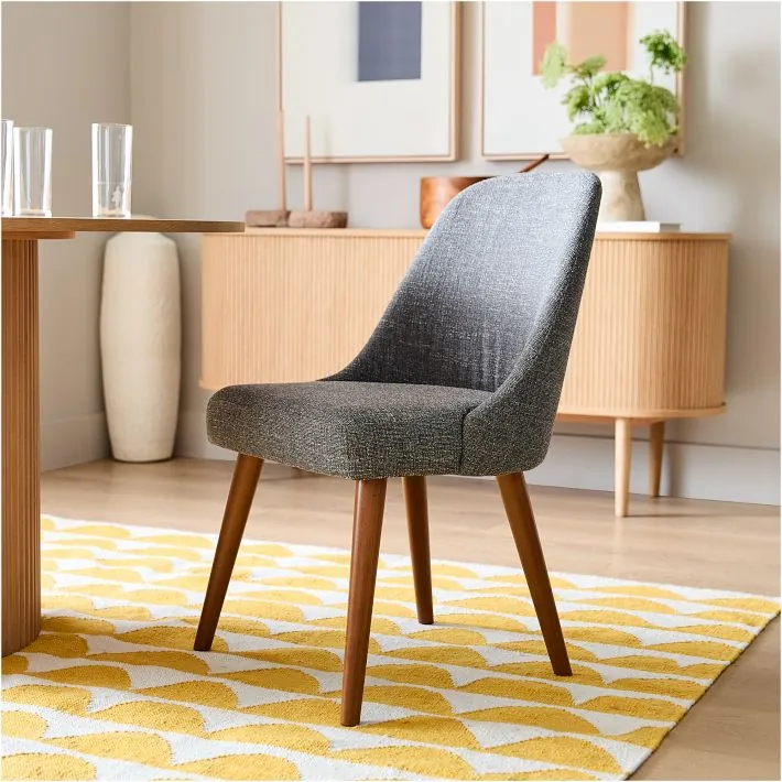 Tape measure showing side chair clearance beneath dining table apron