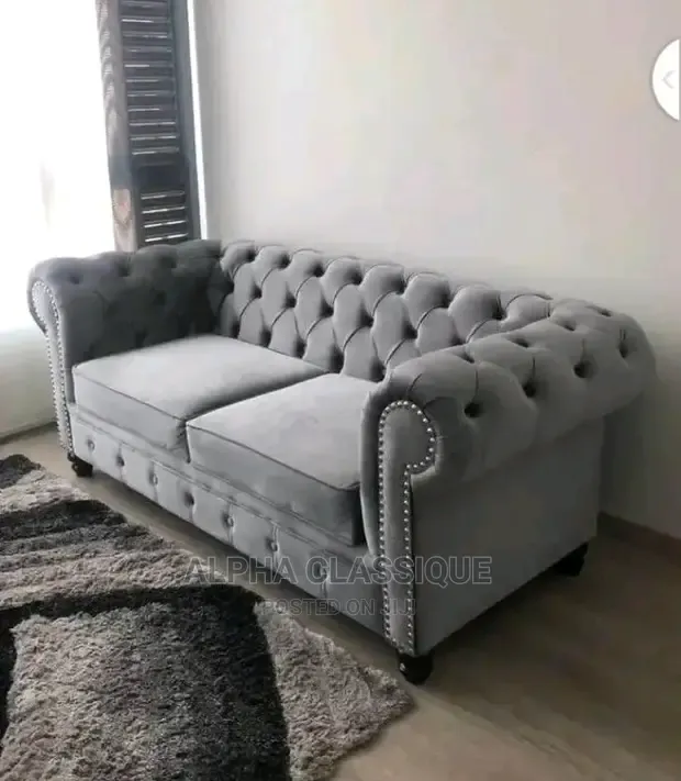 Three different two seater chair options displayed in a modern furniture showroom.