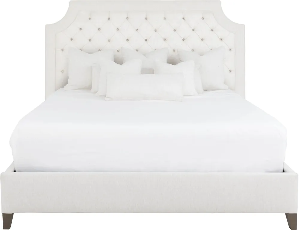 A vanity stool and a bed bench placed in a functional bedroom layout.