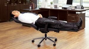 A versatile ergonomic office chair reclined flat for resting in a modern home office.