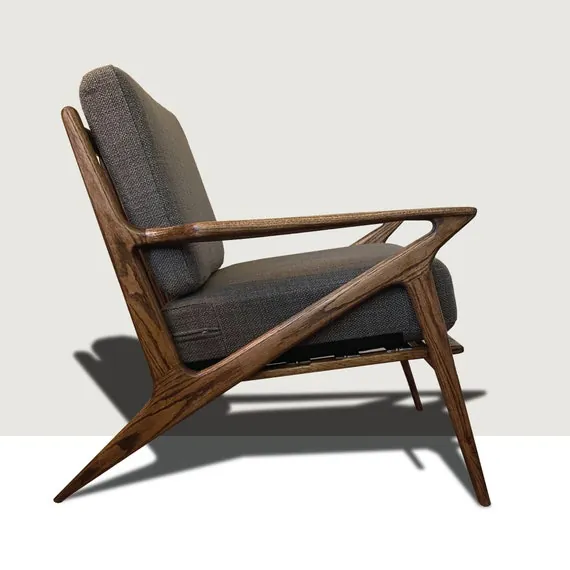 A Wishbone chair and a lounge chair demonstrating different mid century modern chair uses.